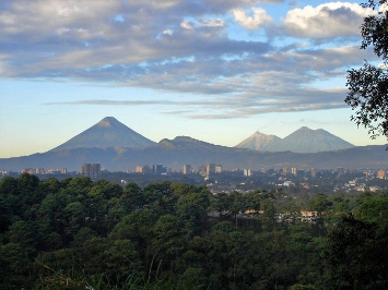 This photo of the Volcanoes surrounding Guatemala City was taken by an unknown photographer.